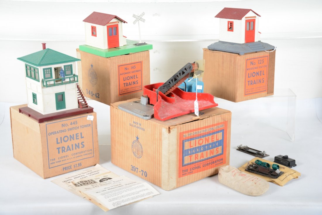 Nice Boxed Lionel 397, 445, 125 & 145: Includes 397 coal loader, complete with insert; 125 whistling shack, complete; 145 gateman, complete, all with 1950 boxes; 445 operating switch tower complete with box & inserts, C7+-8