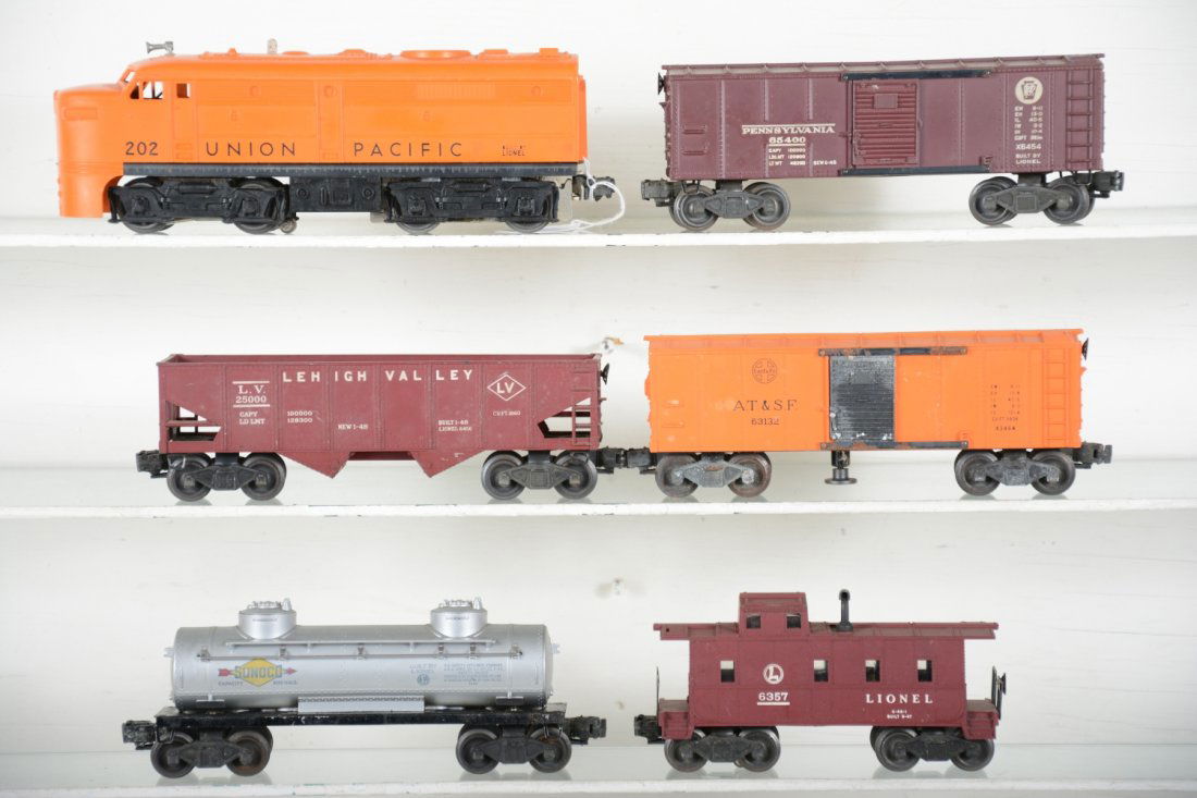 Nice Lionel 202 UP Diesel Freight Set: Includes a tough to find nice, 202 UP Alco diesel; 6454 PRR boxcar; 6456 LV hopper; 3464 SF operating boxcar, C5; 6465 tank car; 6357-25 caboose. Rest show light playwear, C7-7+