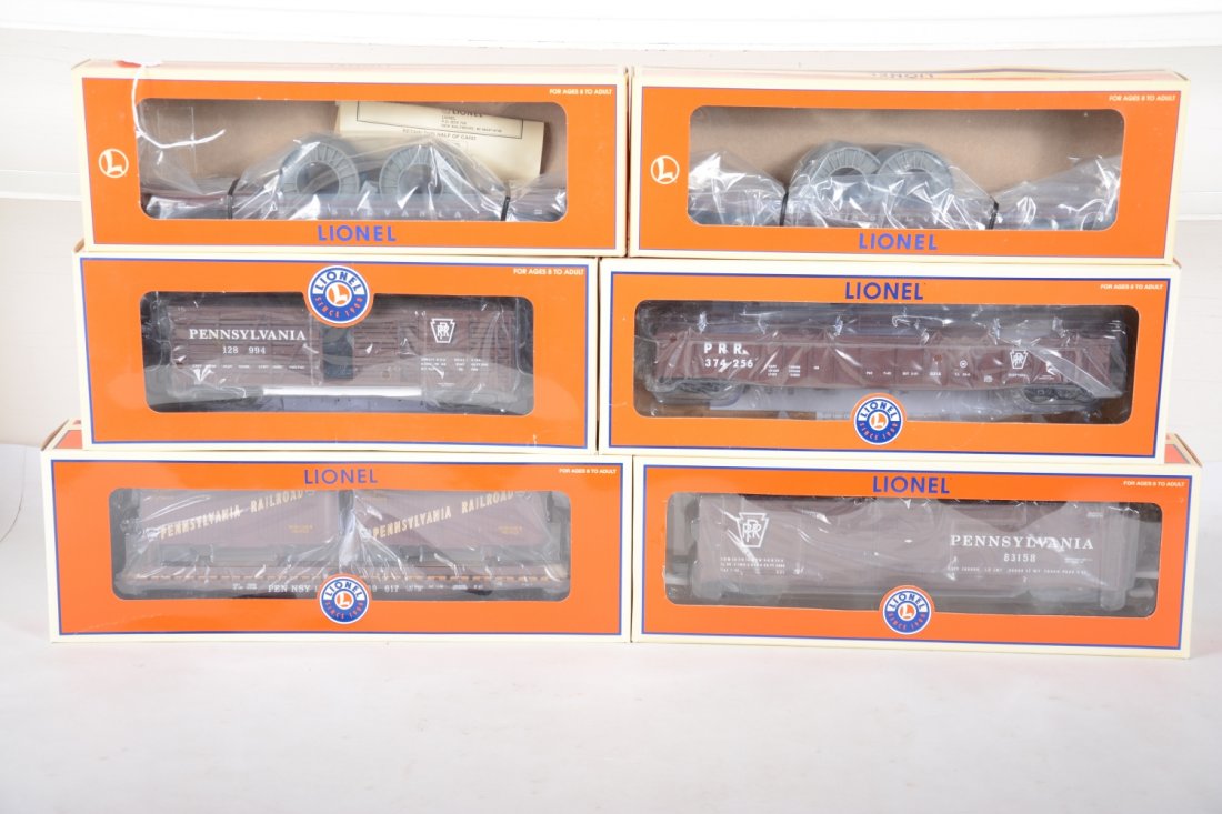 Lionel PRR Standard O Scale Freight Cars: Includes 17261 Double-door boxcar; 17707 PRR 40-ton stock car; 2 #16983 PRR well cars; 17582 PRR Flat with trailers; 17461 PRR PS-5 gondola. All are mint in boxes, C10