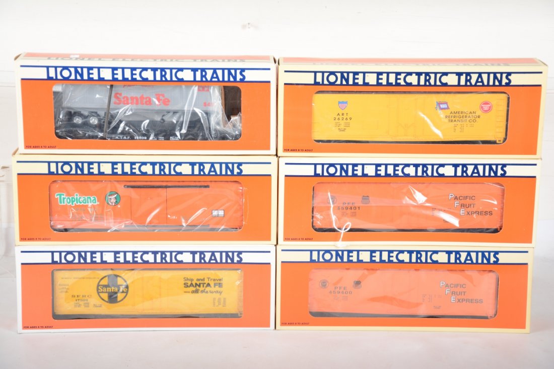 Lionel Standard O Freight Cars: Includes Reefers-17310 Tropicana; 17308 & 17305 PFE; 17304 Wabash; 17302 SF with ETD; 17502 SF flat with trailer. All are mint with boxes, C10