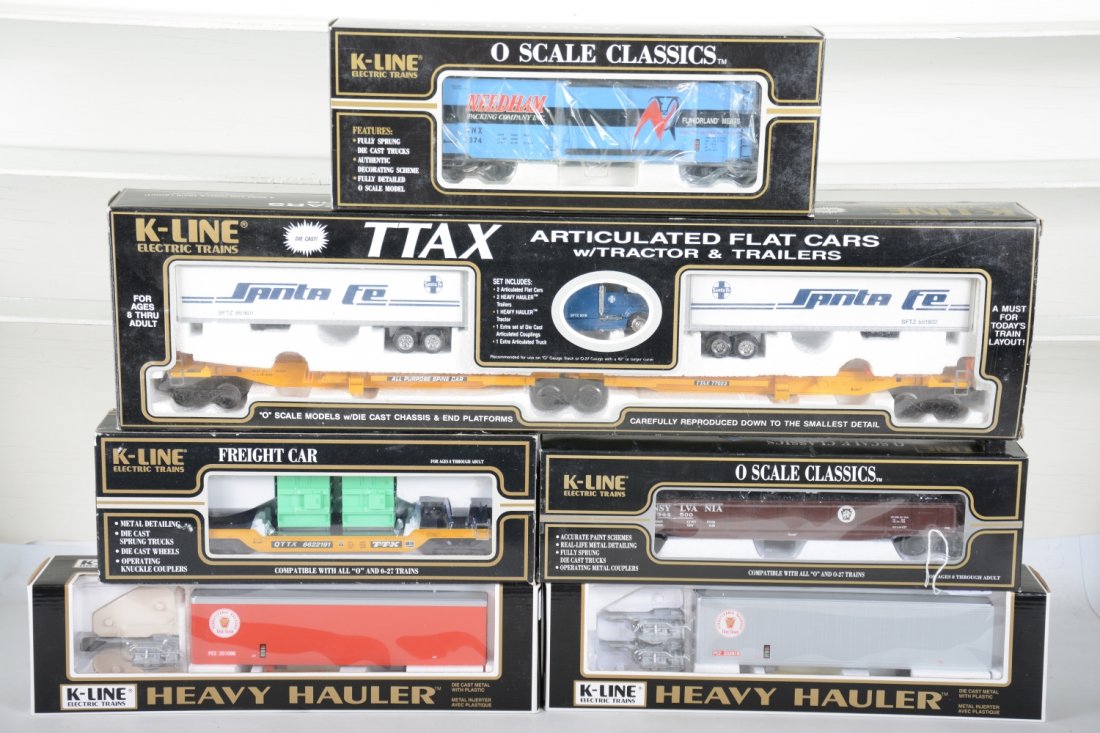 K-Line Freight Cars: Includes a K77023 SF TTAX 2-pack; K652-1891 PRR diecast gondola; K662-2191 flat with transformers; K761-8012 Needham Packing reefer; 2-car heavy hauler truck/rail set. All are new in boxes, C10