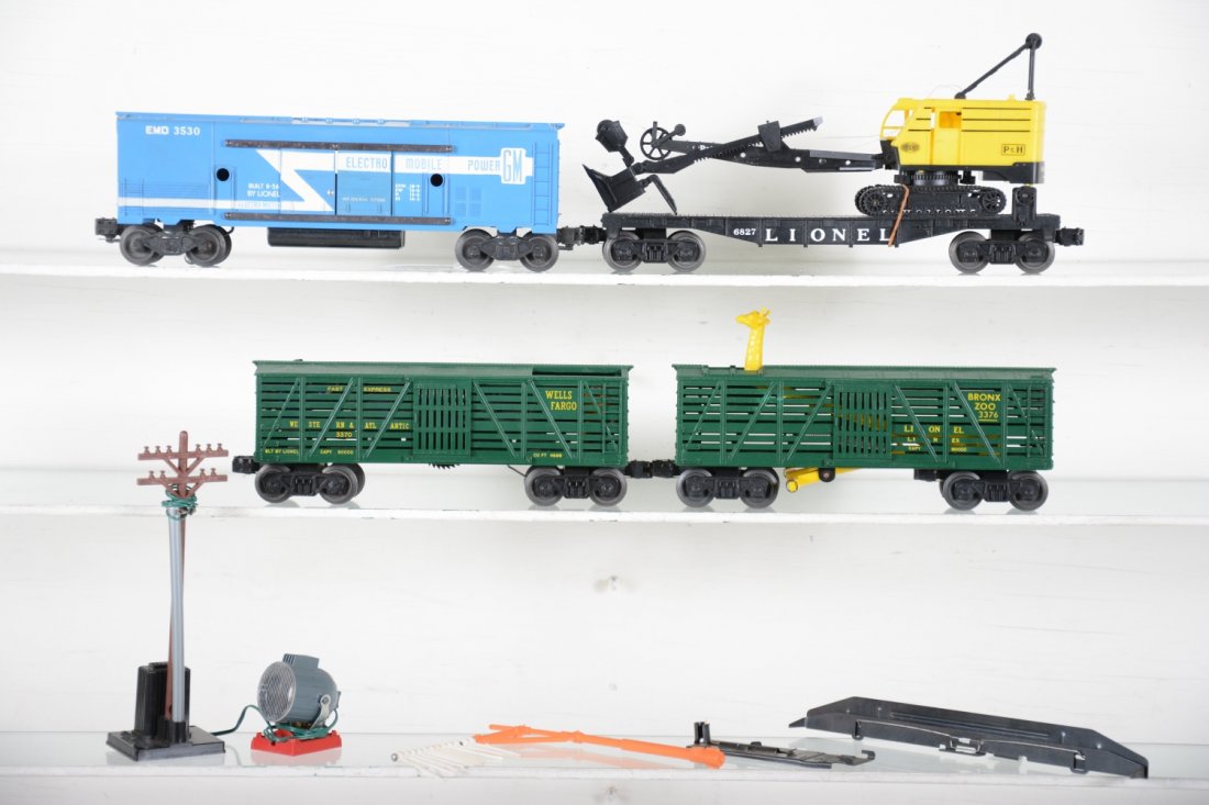 Clean Late Lionel Freight Cars: Includes 6827 flat with shovel, missing wire & 1 top support piece; 3530 generator car with pole; 3370 sheriff & outlaw car, nice figure paint; scarce green 3376 Bronx Zoo car with telltale set. All s
