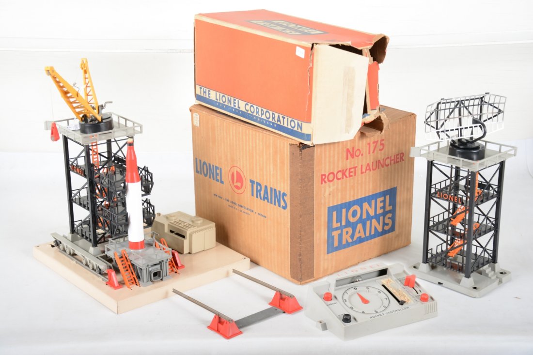 Boxed Lionel 175 & 197 Space Accessories: Includes a 197 radar tower, ob rough; 175 rocket launcher, 1 broken lower railing, Controller has 50% decal, missing red lens, with repro rocket, ob, otherwise C7-7+