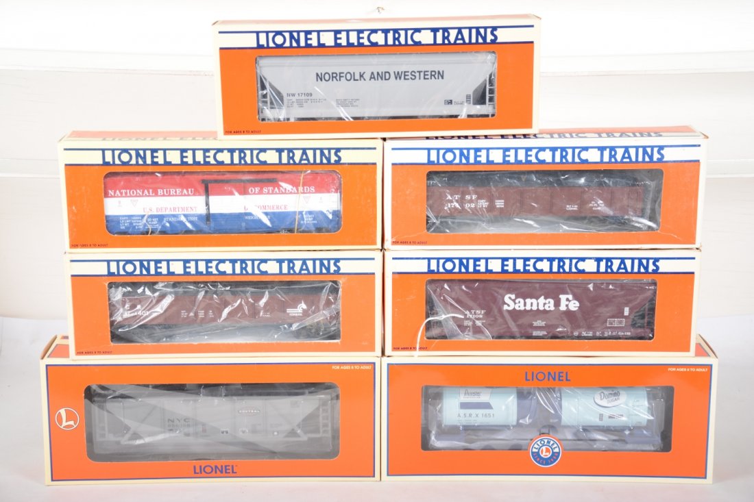 Lionel Standard O Freight Cars: Includes 17947 Domino Unibody tank; 16441 NYC 3-bay hopper; 17109 N&W centerflow hopper; 17402 SF cola gondola; 52098 TTOS boxcar; 17401 Conrail coal gondola; 17109 SF center flow hopper. All appear n