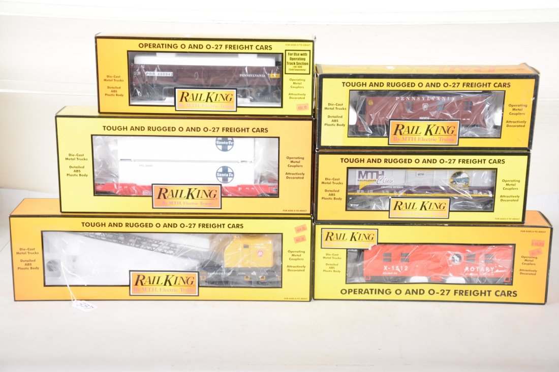 MTH RailKing Freight Cars: Includes 30-7932 American crane; 30-7644 SF Husky Stack car; 30-7423 MTH boxcar; 30-7929 GN rotary snow plow; 30-7715 PRR caboose; 30-7951 PRR Operating dump car. Most appear new in boxes, C9-10