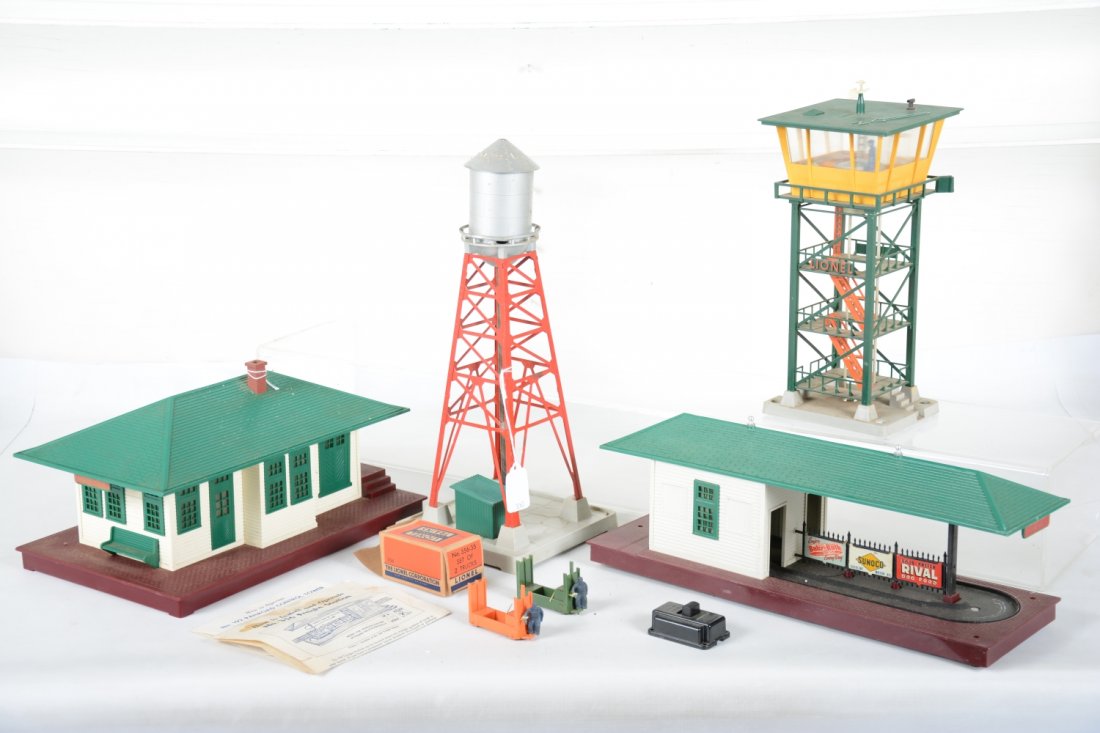 Lionel 192, 356, 132 & 193 Accessories: Includes a 192 control tower with instructions; 132 stop station, light paint spots on roof; 356 operating Freight station with -35 box & 364c; 193 industrial water tank, missing light cap. All show m