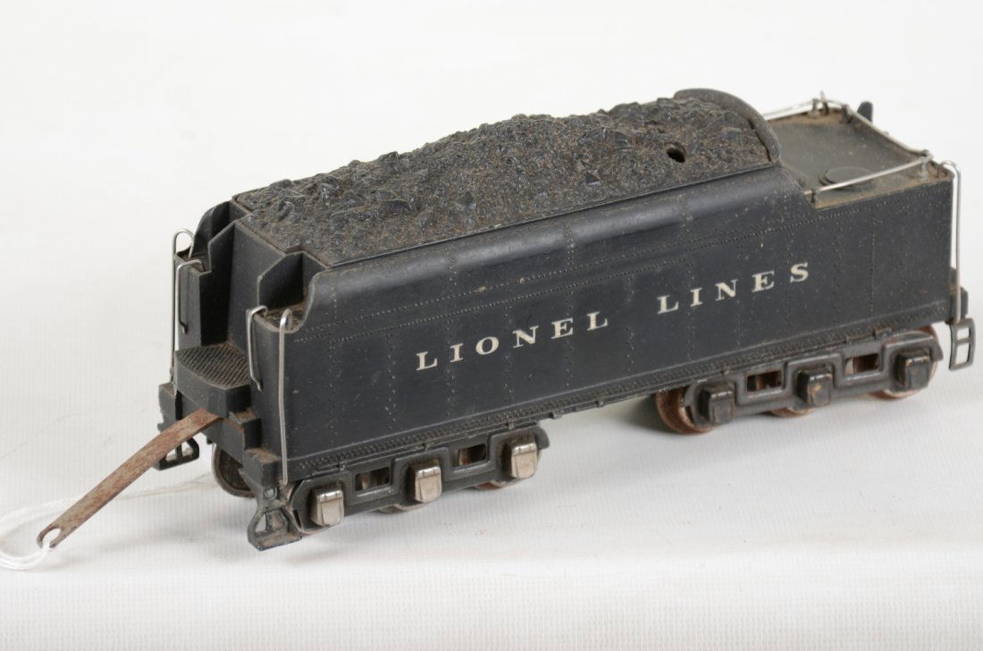 Lionel 2226W Diecast Whistle Tender: Nice shell with cast whistle; Hs mixed non-coupler trucks with replaced handrails, still tough piece that will complete your 226E or 763E locos. What is hear shows light to moderate playwear, C7