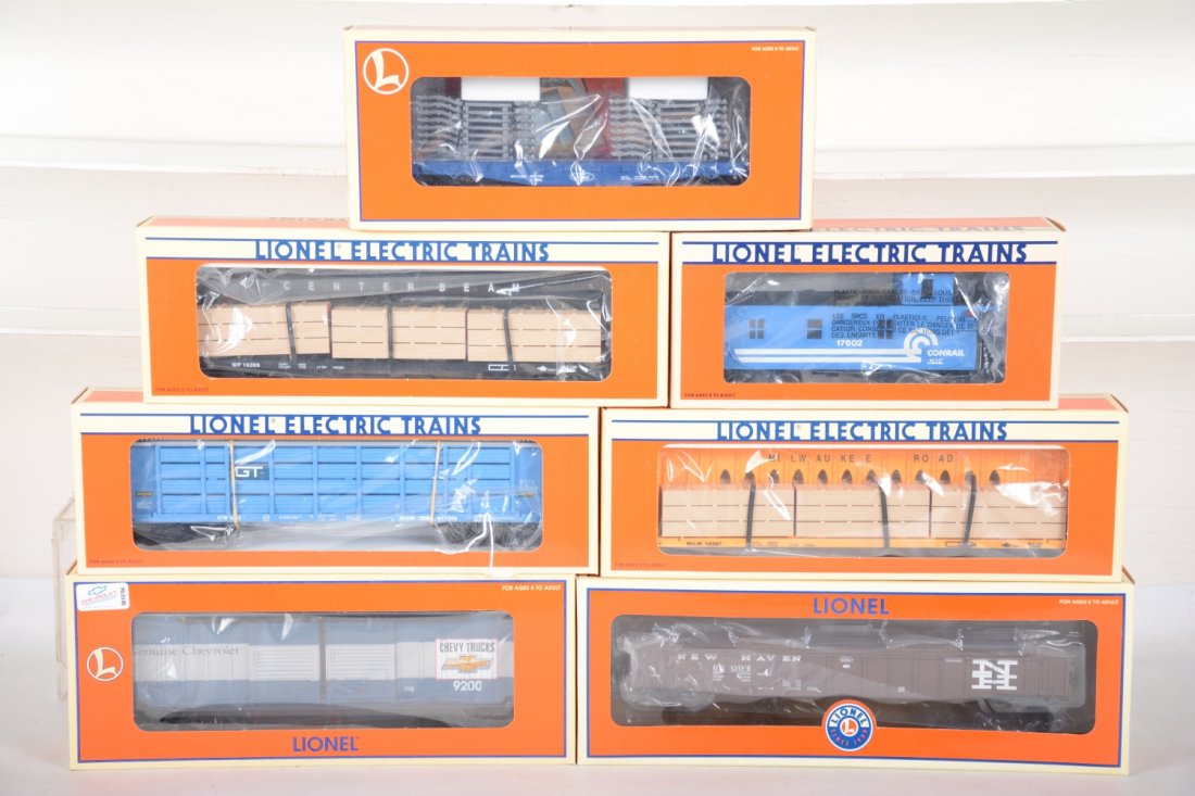 Lionel Standard O Scale Freight Cars: Include a 17255 Chevy D-Door boxcar; 17633 Trailer Tran flat with frames; 17602 Conrail caboose; 17472 NH PS-5 gondola with cover; 16399 WP I-beam lumber flat; 18242 GT auto-laoder; 16397 MR I-Beam lu