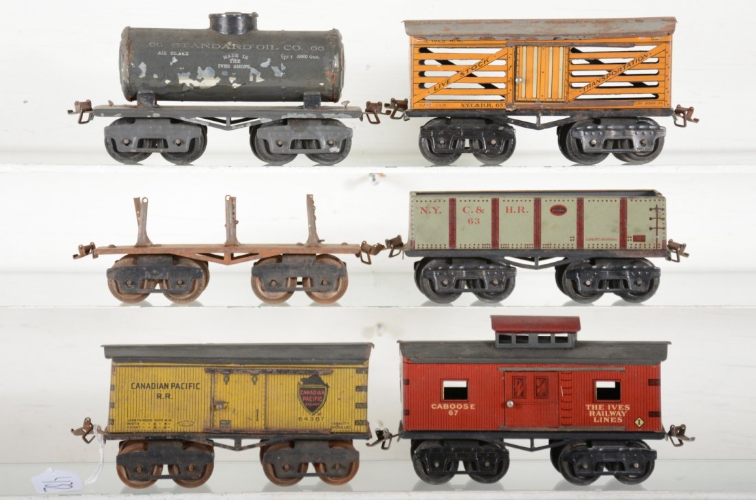Ives Freight Cars: Includes a 64 CP boxcar; 63 gondola; 61 lumber car with 2 chains, no load; 66 tank, flaking 50%; 65 stock car. All could benefit from a cleaning, rest show modertae wear, C5+-6