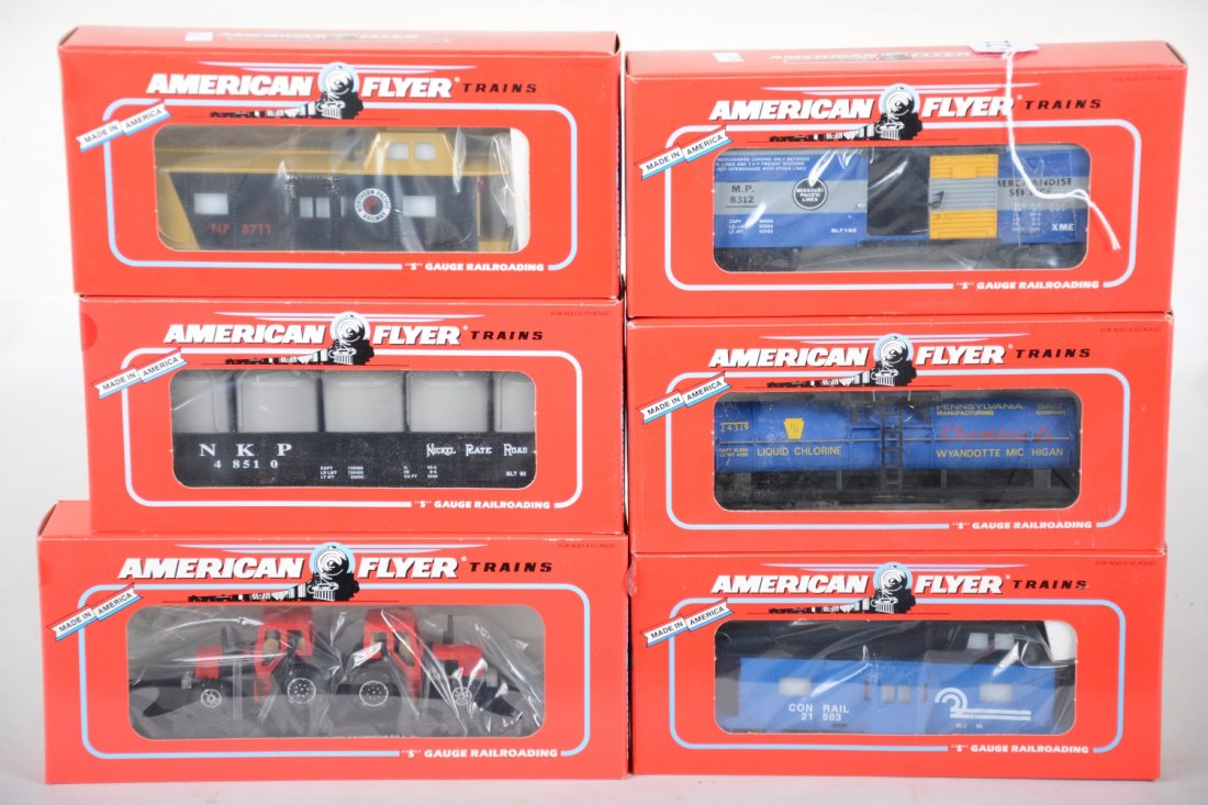 Lionel American Flyer Freight Cars: S Gauge. Includes 48402 PENN Salt tank; 487312 MP boxcar; 48711 NP bay window caboose; 48710 Conrail bay window caboose; 48509 AF flat with tractors; 48510 NPR canister car. All are mint factory fresh