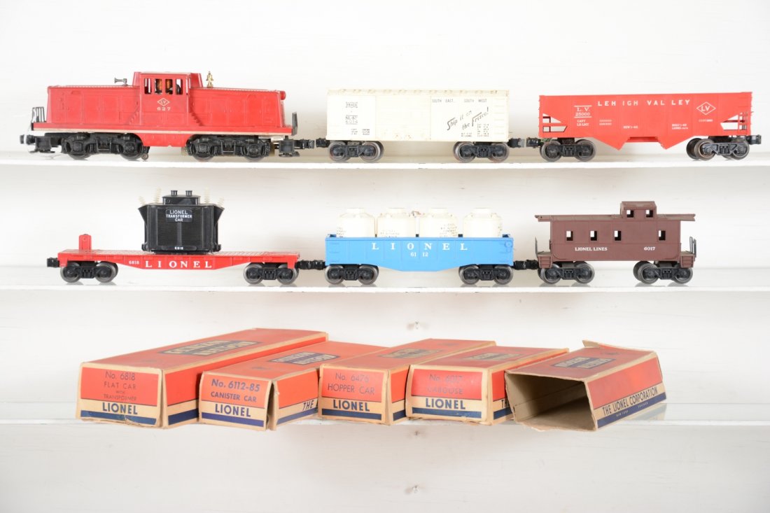 Lionel 627 Diesel Freight Set, Most Boxed: Includes a 627 LV 44-ton diesel with nice striping; 6014-85 Frisco boxcar; 6112-85 gondola with canisters; 6818 flat with transformer; 6476 hopper; 6017 caboose, all show light playwear with all cars