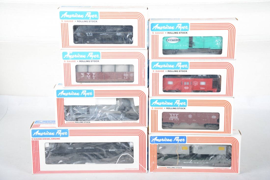 Lionel American Flyer NYC Diesel Freight Set: S Gauge. Includes 8552 NYC GP-9 diesel; 49001 operating searchlight; 9713 boxcar; 9209 hopper; 9106 tank car; 9304 canister car; 9005 flat with vans; 9404 bay window caboose. All are mint factory fres