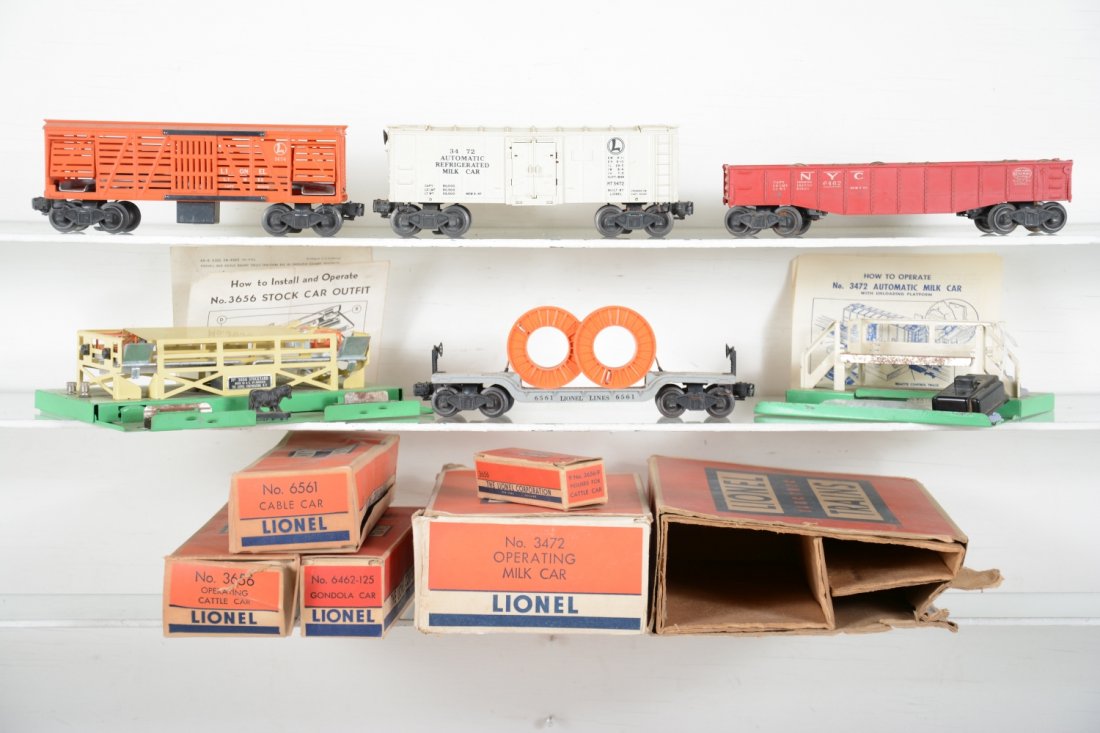 Boxed Lionel Rolling Stock: Includes 3656 cattle car with pen, 98% complete with -35 box & instructions, C8; 6461 flat with reels; 6462-125 gondola with barrels; 3472 milk car with platform & instructions, top a bit rusty, repla