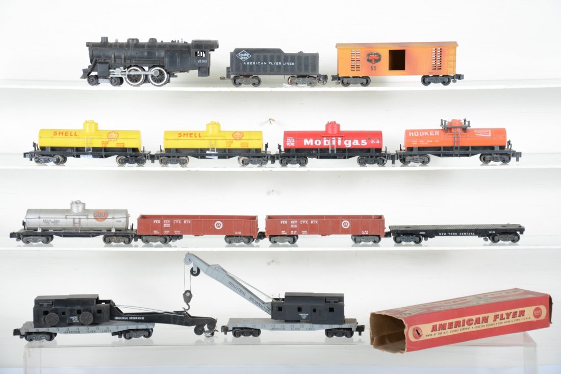 American Flyer Steam Freight Lot: S Gauge. Includes a 21160 Reading Atlantic; 2 #24328 Shell tank cars, 1 has broken coupler; 24110 PRR gondola; 24329 Hooker tank car; 27055 Bullion car, K/C; 24561 crane, worn ob, C9; 24309 Gulf tank,