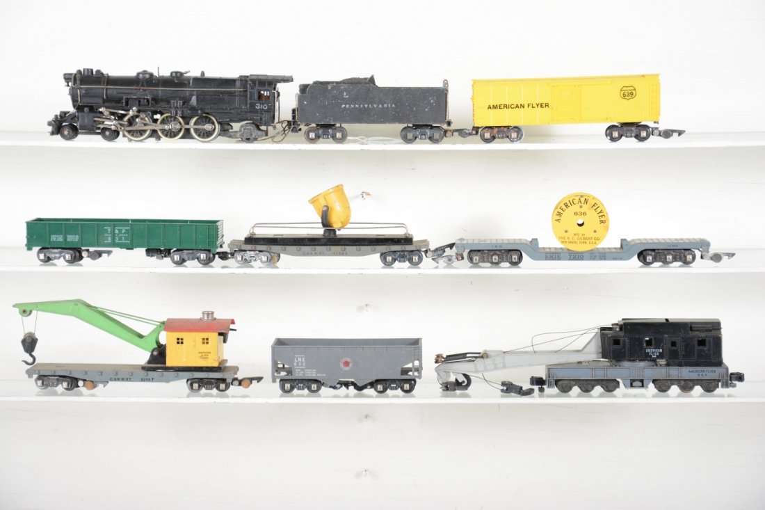 American Flyer 310 Steam Freight Set: S Gauge. Includes an early 310 PRR K-4 Pacific, missing fiber board connector; 944 crane; 636 AF reel car, no wires; 634 searchlight; 639 boxcar; 632 LNE hopper; 631 T&P gondola; 635 crane. All need a