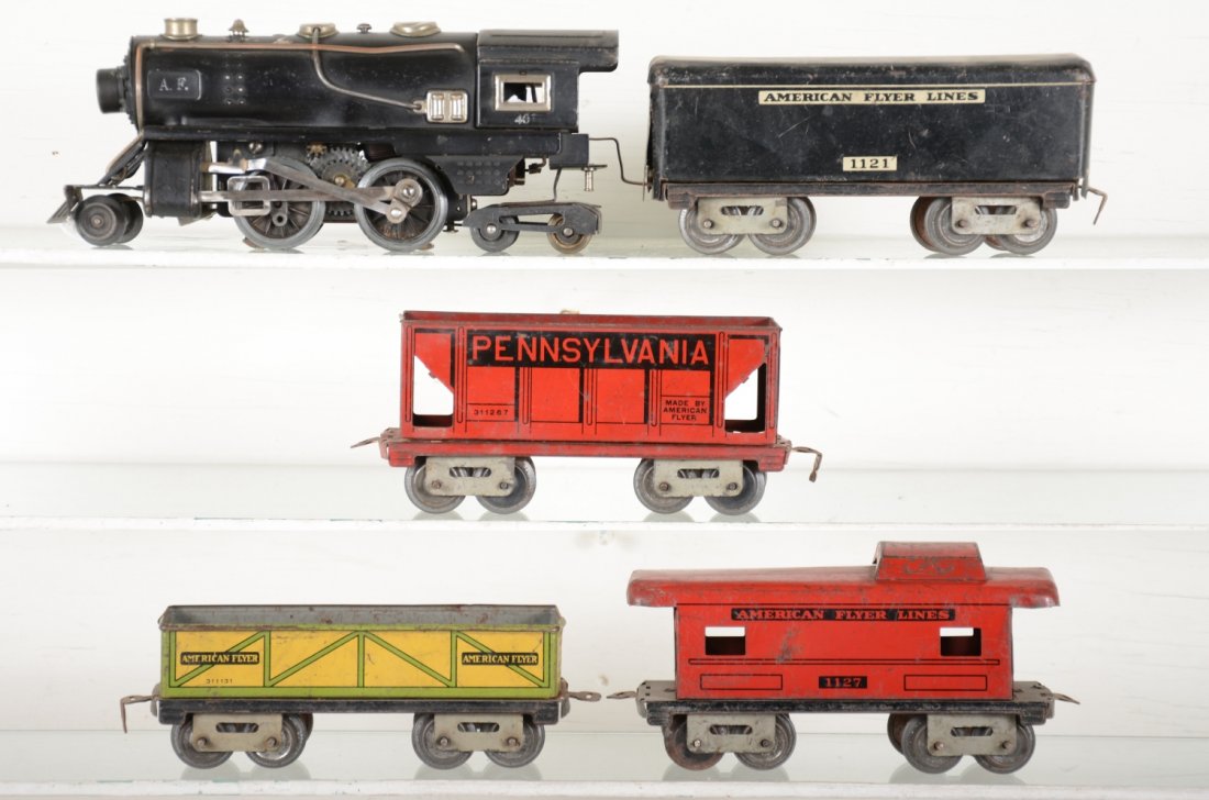 American Flyer 401 Steam Freight Set: Circa 1938. Includes a 401 2-4-4 steam loco; 1121 tender; 1113 sand car; 1126 hopper; 1127 caboose, touched-up roof. All show moderate playwear, C5-5+