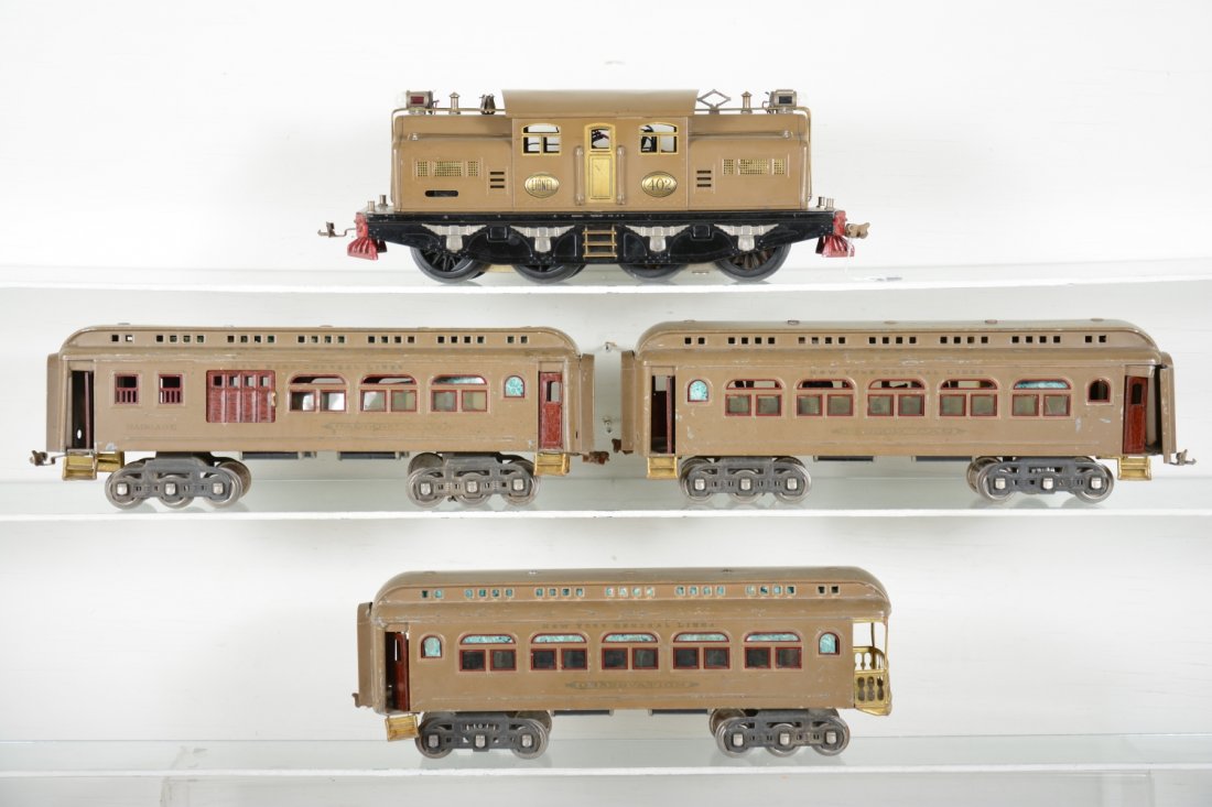 Clean Lionel 402 Passenger Set: Standard gauge. Includes a 402 dual motor electric, late original wheels; 419 combine; 418 Pullman; 490 observation. They are shiny with nice lettering. They show moderate playwear, C6