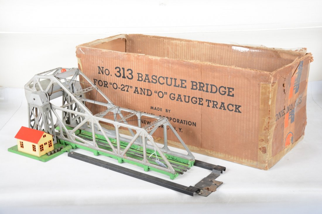 Boxed Lionel 313 Bascule Bridge: Fairly straight castings with centering frame. It shows moderate playwear with taped original box, C6