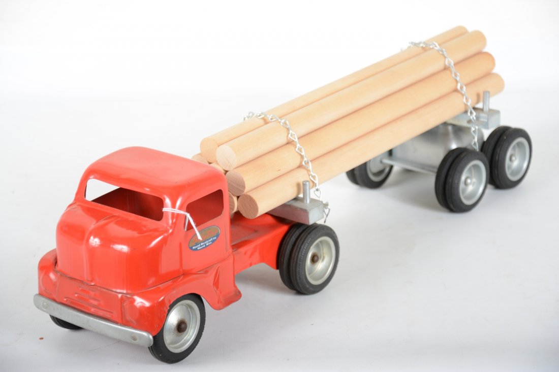 Clean Early Tonka Log Truck: Circa 1953 #575-3 has clean, shiny tractor with nice decals. Trailer has replaced chains, load probably as well, no age to logs. It shows light playwear, rest C8