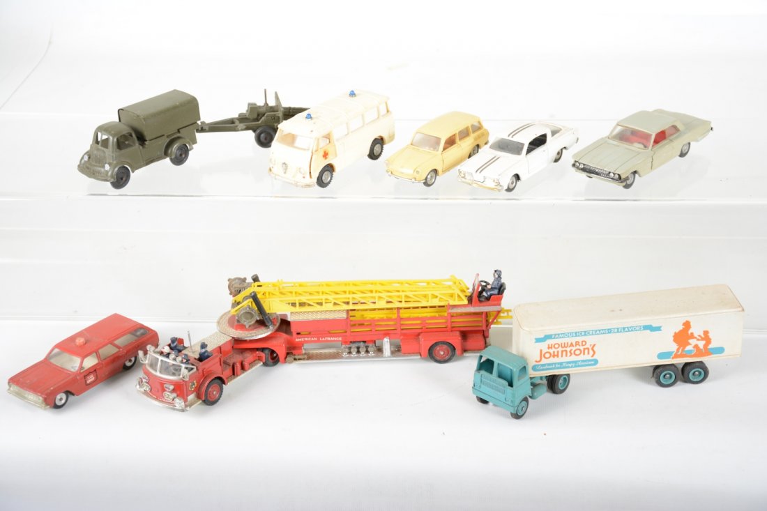 Assorted Vintage Diecast & Plastic Vehicles: Includes an early Bembros army truck with gun trailer; early Winross Howard Johnsons tractor trailer; Cragstan(Sabra) Plymouth Barracuda & Rambler Fire Chief wagon; Corgi 1143 fire ladder truck; Polis