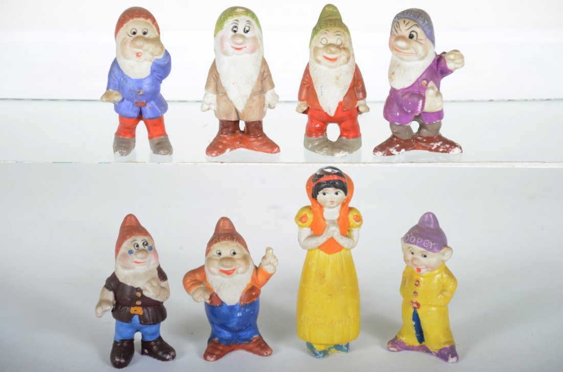 Vintage Bisque Snow White & 7 Dwarfs: 4" Snow white, all have better than average paint, but snow white has been repaired. Otherwise appear intact, except Grumpy has missing fingers on 1 hand. They show moderate playwear, otherwise C6. St