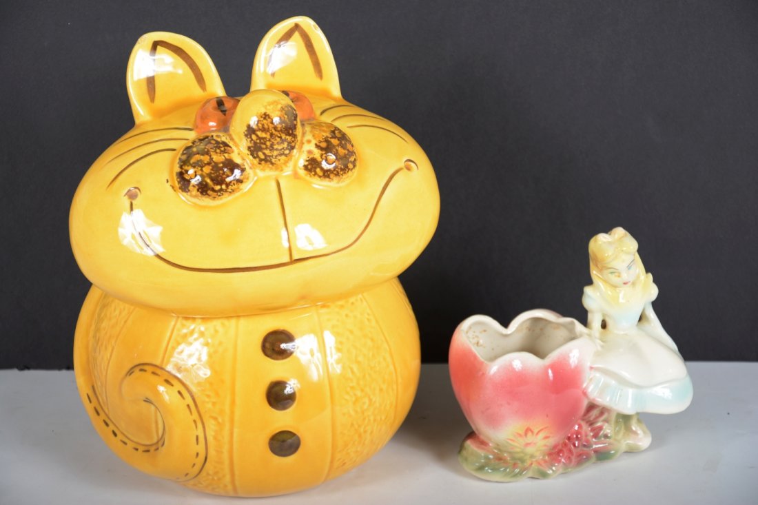 Disney Alice In Wonderland Pottery: Includes a 12" Cheshire Cat cookie jar, unmarked, 1 chip in ear; Alice planter with in in nice condition (Expect large box to properly protect these in shipping)