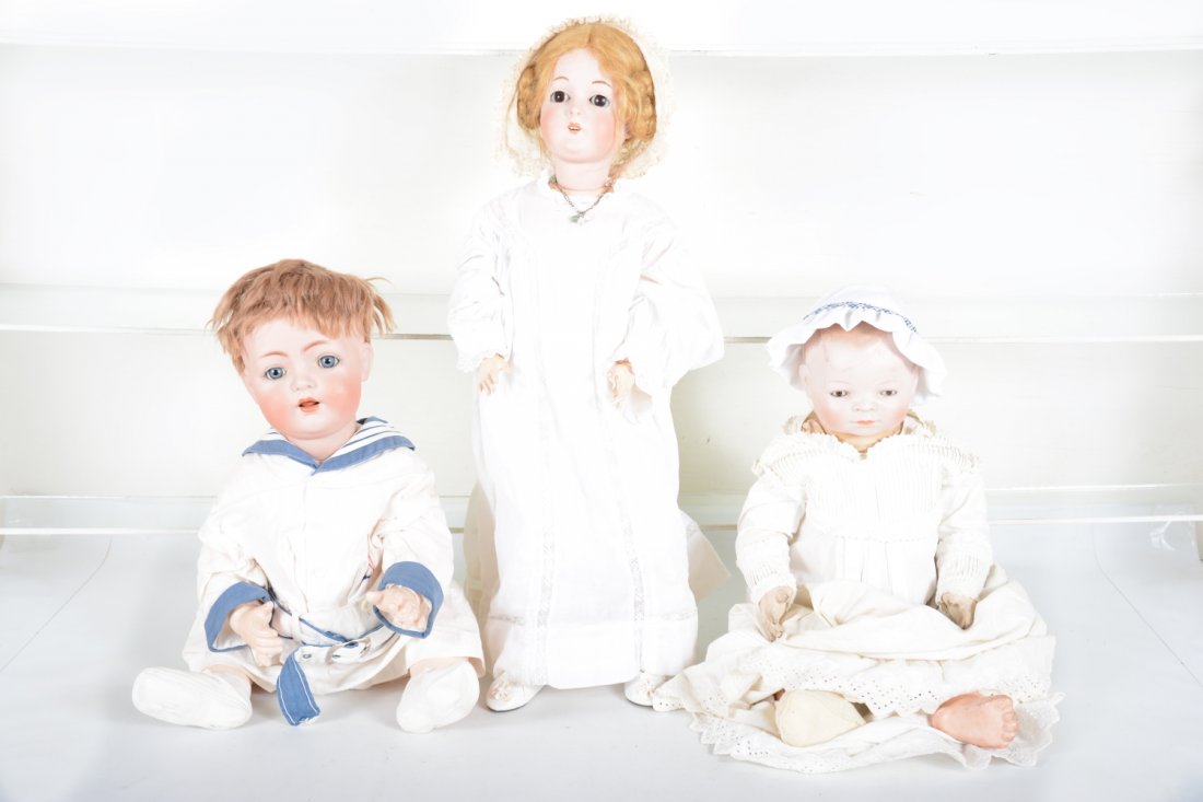 Vintage Doll Group: Includes a vintage Grace Putnam Bisque Bye-Lo baby doll. 23" tall with later clothes. The head is cracked and repaired, fingers are crazed; 19th century Queen Louise Bisque doll. 23" tall, professiona