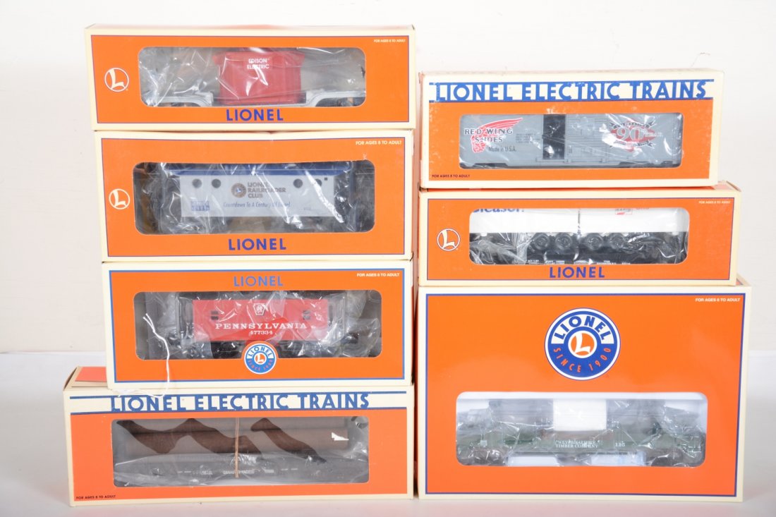 Lionel Freight Cars: Includes 36604 PRR caboose; 16264 Red Wing boxcar; 17500 CP Rail log flat; 19424 transformer car; 26888 Weyerhaeuser log dump; 52114 TTOPS trailer flat; 19774 LRRC caboose. All appear new in boxes, C1