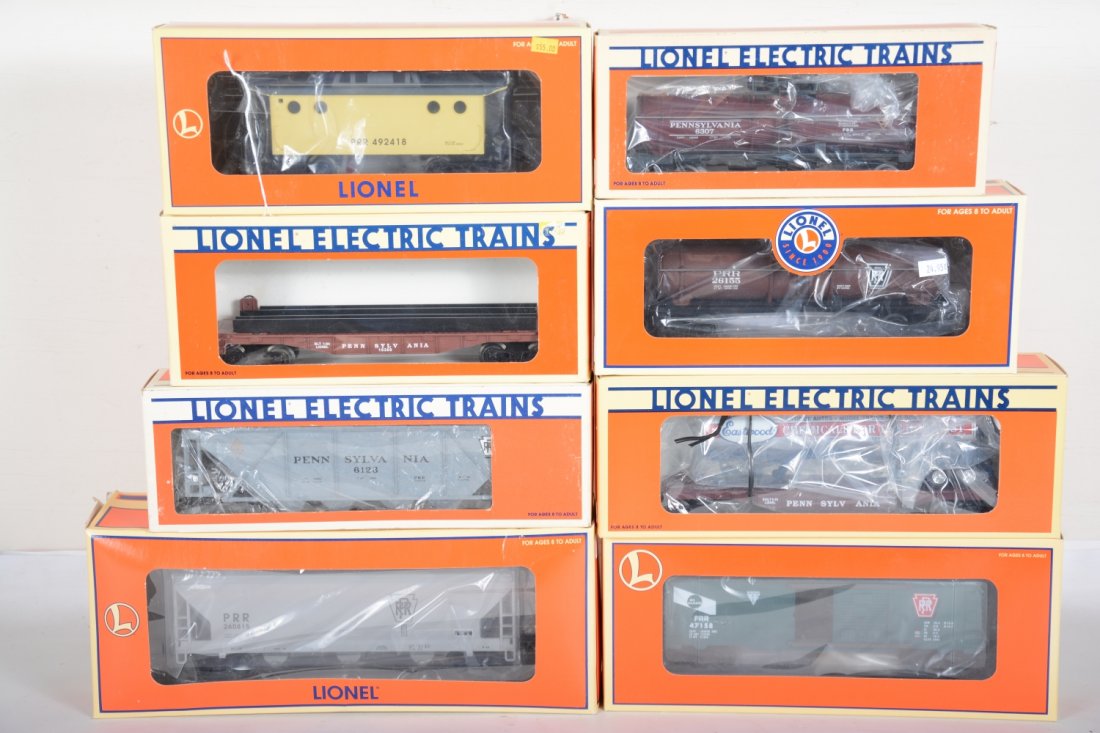 Lionel PRR Freight Cars: Includes 19751 CB8 caboose; 17132 hopper; 6123 covered hopper; 26155 tank car; 52083 trailer flat; 6307 tank car; 16389 wheel car; 29297 boxcar. All appear new in boxes, C10