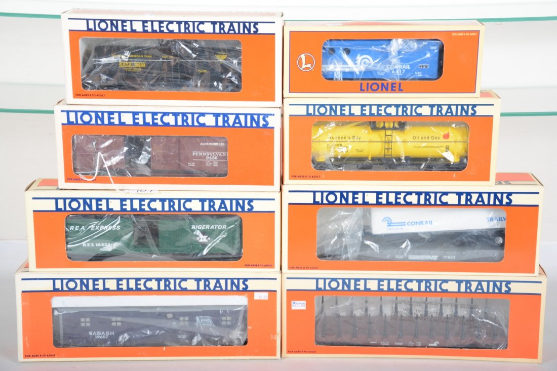 Lionel Freight Cars: Includes 19567 Wabash smoking bunk car; 17501 Conrail stake flat; 19603 GATX tank; 9456 PRR boxcar; 19738 Conrail caboose; 19605 Hudson Bay tank; 16235 REA reefer; 17503 NS trailer flat. All appear ne