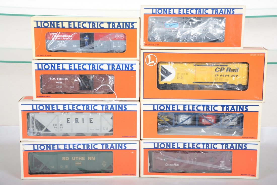 Lionel Freight Cars: Includes 9451 Southern boxcar; 6104 Southern hopper; 19827 NYC operating boxcar; 5728 CP bunk car; 6118 Erie hopper; 52044 vat car; 19601 NA tank car; 29252 CP boxcar. All appear new in boxes, C10