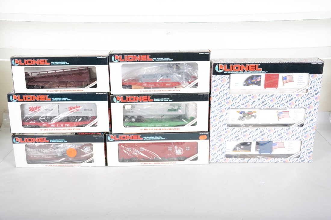 Lionel Rolling Stock: Includes 16317 PRR ramp car; 19212 PRR Boxcar; 16803 LRRC searchlight; 19652 JC bunk car; 19599 Old Glory 3-pk boxcars; 16308 BN trailer flat; 16330 MKT trailer flat. All appear new in boxes, C10