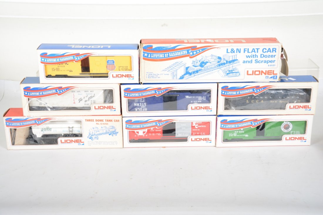 Early Lionel MPC Freight Cars: Includes 6014-900 LCCA boxcar; 1976 LCCA tender; 9203 UP boxcar; 9205 NW boxcar; 9202 SF boxcar; 9250 Waterpoxy tank; 9204 NP boxcar; 9121 L&N flat with dozer & scraper, ob missing 1 flap, all appear 