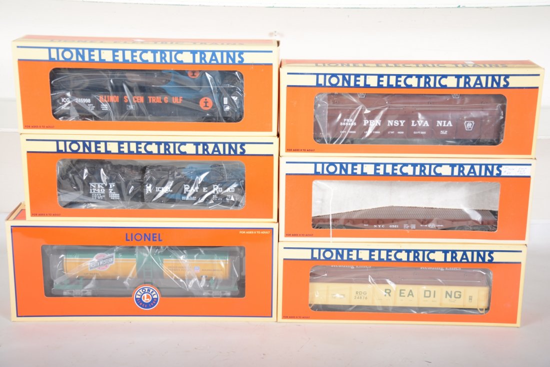 Lionel Standard O Freight Cars: Includes 17404 IC covered gondola; 17406 PRR coil car; 17407 NPR gondola with scrap load; 6521 NYC stake flat; 52455 CNW unibody tank car; 17405 Reading coil car. All appear new in boxes, C10