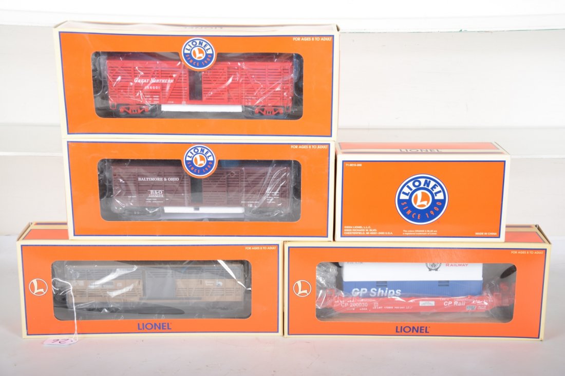 Lionel Lot: Includes 18981 PRR Speeder; 17704 B&O Standard O stock car; 52195 double-stack car; 19775 LRRC stock car; 17706 C&O stock car. All appear new in boxes, C10