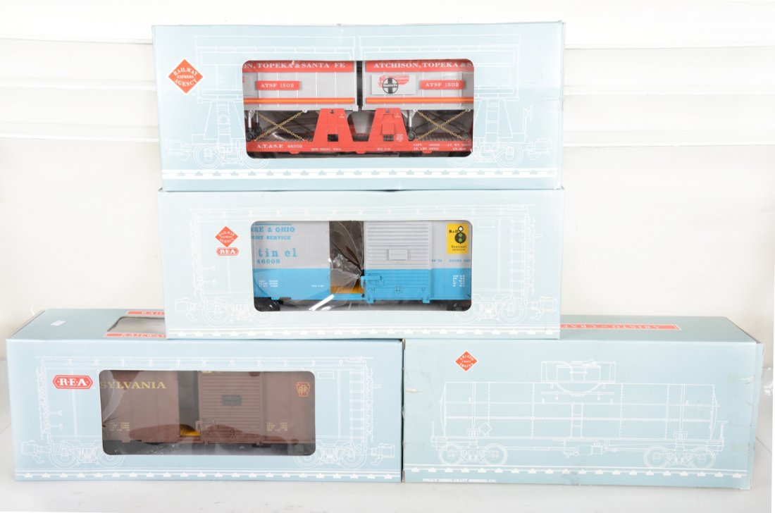 4 Aristo Craft Freight Cars: G Gauge. Includes 46001 B&O boxcar, ob's cellophane worn; 46502 SPE piggy-back flat; 46001 PRR boxcar; 41309 Sinclair tank car. Most appear new in boxes, C9-10