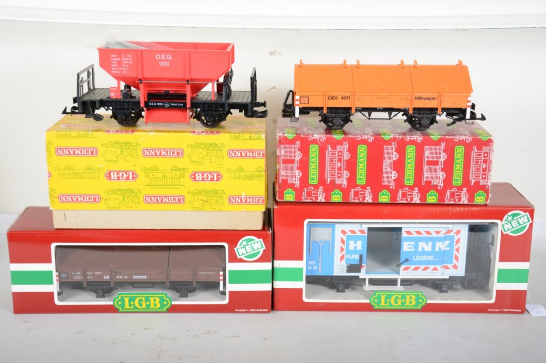 4 LGB 4-Wheel Freight Cars: G Gauge. Includes 4011 OEG salt car; 4041 ballast car; 4228 Henniez goods wagon; 4111 DR salt car. Most appear new in boxes, C9-10