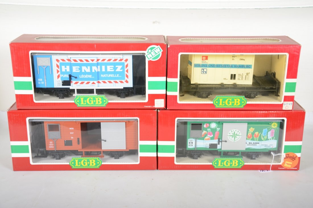 4 LGB 4-Wheel Freight Cars: G Gauge. Includes 4228 Henniez reefer; 4003 container flat; 4027 MOB goods wagon; 4128 R. Blank goods wagon. Most appear new in boxes, C9-10