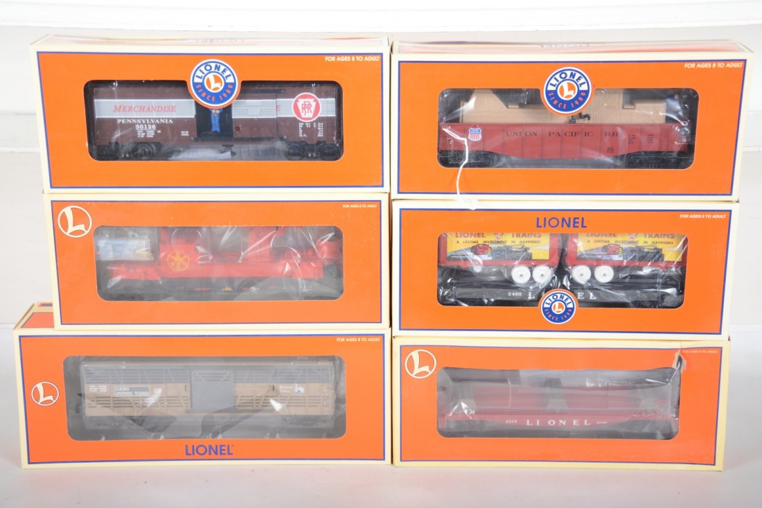Lionel Freight Cars: Includes 52281 PRR operating boxcar; 19775 Lark stock car; 28991 Louisville ladder car; 19484 lumber car with load; 29460 Flat with trailers; 26791 UP Chase gondola. All appear like new with boxes, C9