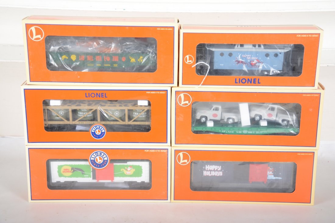 Lionel Freight Cars: Includes 36207 & 36213 Vapor boxcars; 294654 US Army vat car; 17561 NYC flat with pick-ups; 19476 gondola; 19781 Vapor caboose. All appear new in boxes, C10