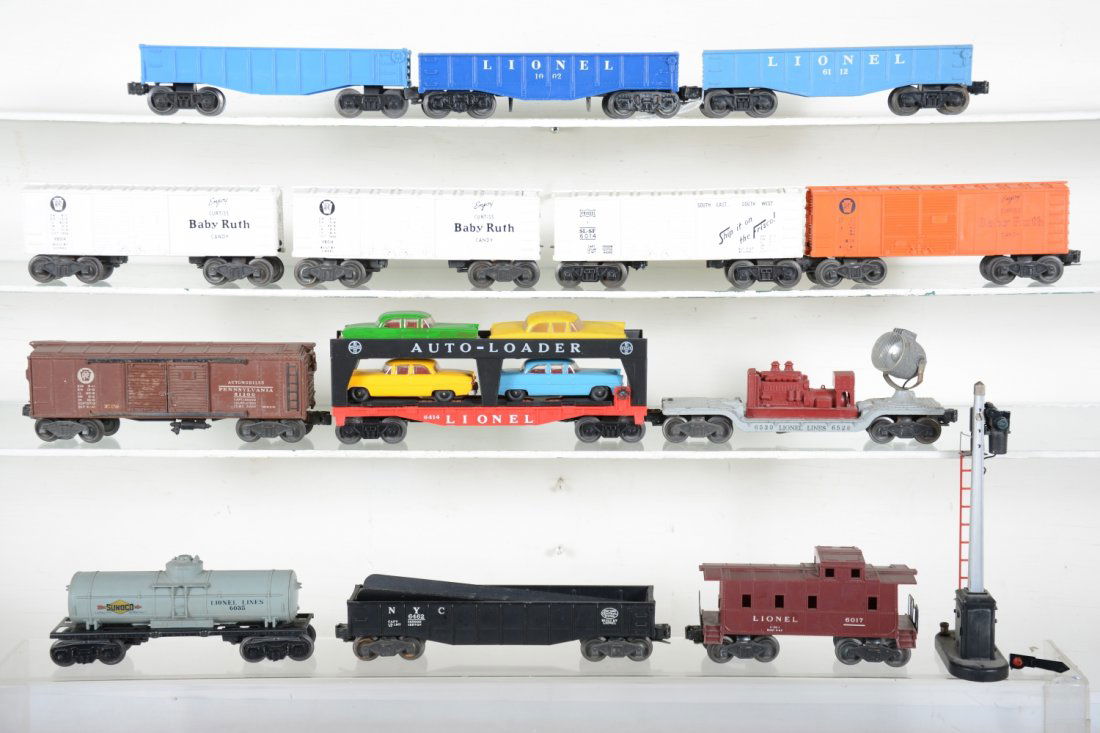 Lionel Freight Cars: Includes a 6520, 6035, 1004, 6112, 3 #6014, 1002; (6142), 6462 with culvert insert, 6014 cars repainted, 6017(underscored version), 151, broken flag. Rest show light to moderate playwear, C7