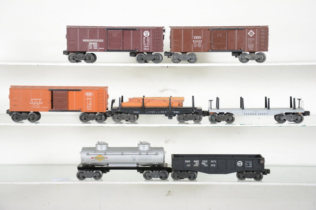 Clean Lionel Freight Cars: Includes tougher 6454 NYC boxcar, tan; 6465 tank; 6411 flat; 6454 Erie boxcar; 2452 gondola, 6454 PRR boxcar; 3461 log dump. All show light to moderate playwear, C7-7+