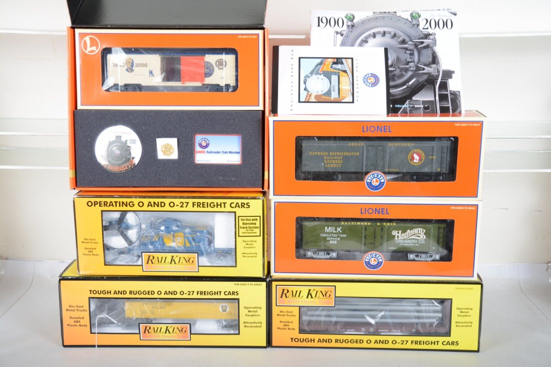 Lionel & MTH Freight Cars: Includes MTH 30-7218 PRR snow plow; 30-79340 L&N operating copter car; 30-76015 LV pipe car; Lionel Gold Member car; 52376 REA reefer; 52333 Harmony milk car with Lou Redman figure. All appear like ne