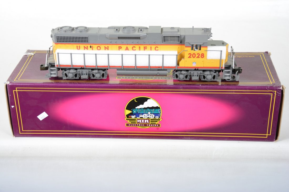 MTH 20-2188-1 UP GP38-2 Diesel: Nice dual motor diesel with cab lights, ProtoCouplers, ProtoSounds with Freight station ProtoEffects & more! It shows very light runtime with C9 body with box.