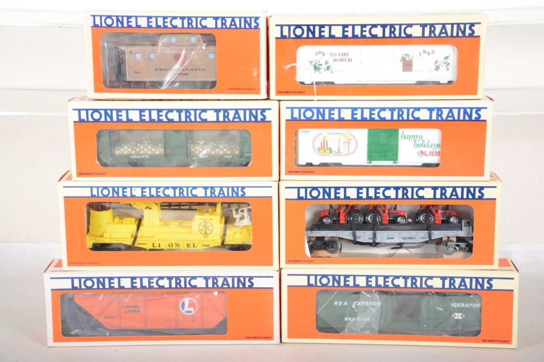 Lionel Freight Cars: Includes 16235 REA reefer; 19419 mint car; 18907 flat with farm tractors; 19910 seasons greetings 1990; 19922 Christmas 1993 b/c; 19303 LL coal hopper; 19702 PRR Mint caboose; 16660 fire ladder car, m