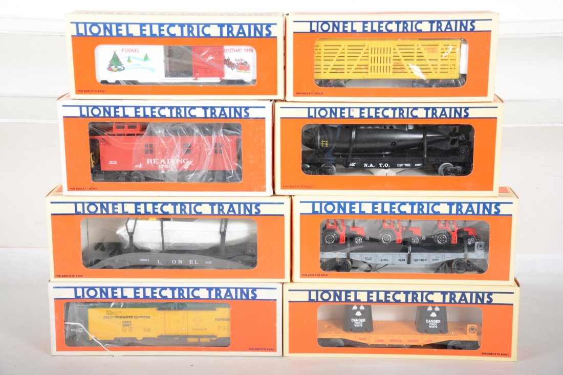 Lionel Freight Cars: Includes 16677 flat with NATO submarine; 16661 flat with operating boat; 16666 toxic waist flat; 16907 flat with farm tractors; 19929 Xmas boxcar; 16682 Bugs Bunny & Yosemite Sam car; 9887 FARR reefer