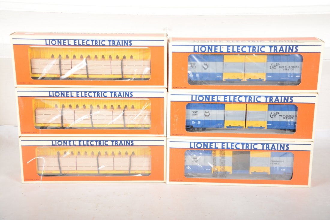 Lionel Standard O Freight Cars: Includes 3 #16380 UP I-Beam flat cars with lumber; 3 #17204 MP double-door boxcars. All new in boxes, C10