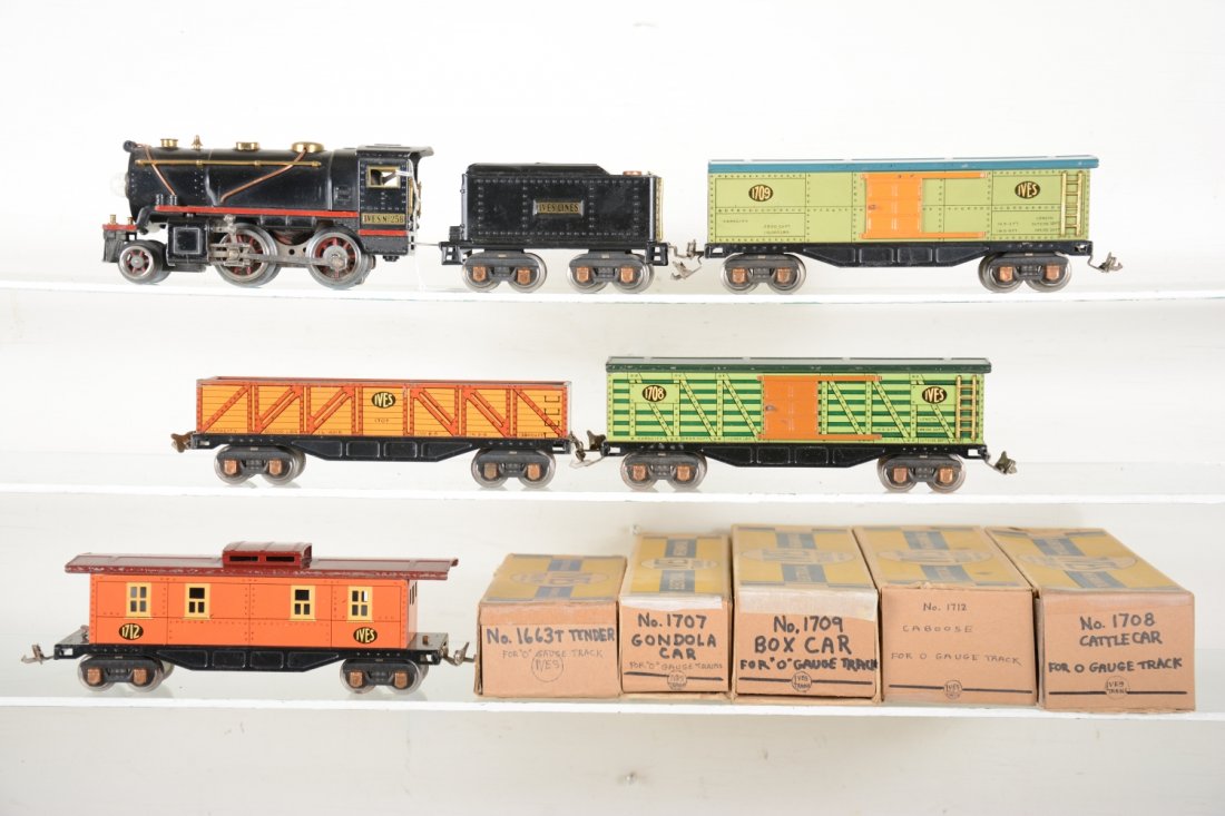 Boxed Ives 258 Freight Set: Circa 1930. Includes an Ives 258 steam loco. It has Ives plates and motor plate, but original Lionel frame with red painted over orange stripe, no box; 1663T tender; 1707 gondola; Scarce 1708 stock ca