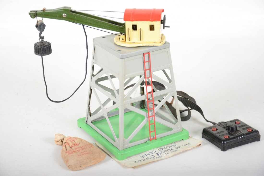 Nice Lionel Gray 165 Magnetic Crane: 1942. Clean and complete with controller, instructions and partial scarce bag with scrap. It shows light playwear, C7+