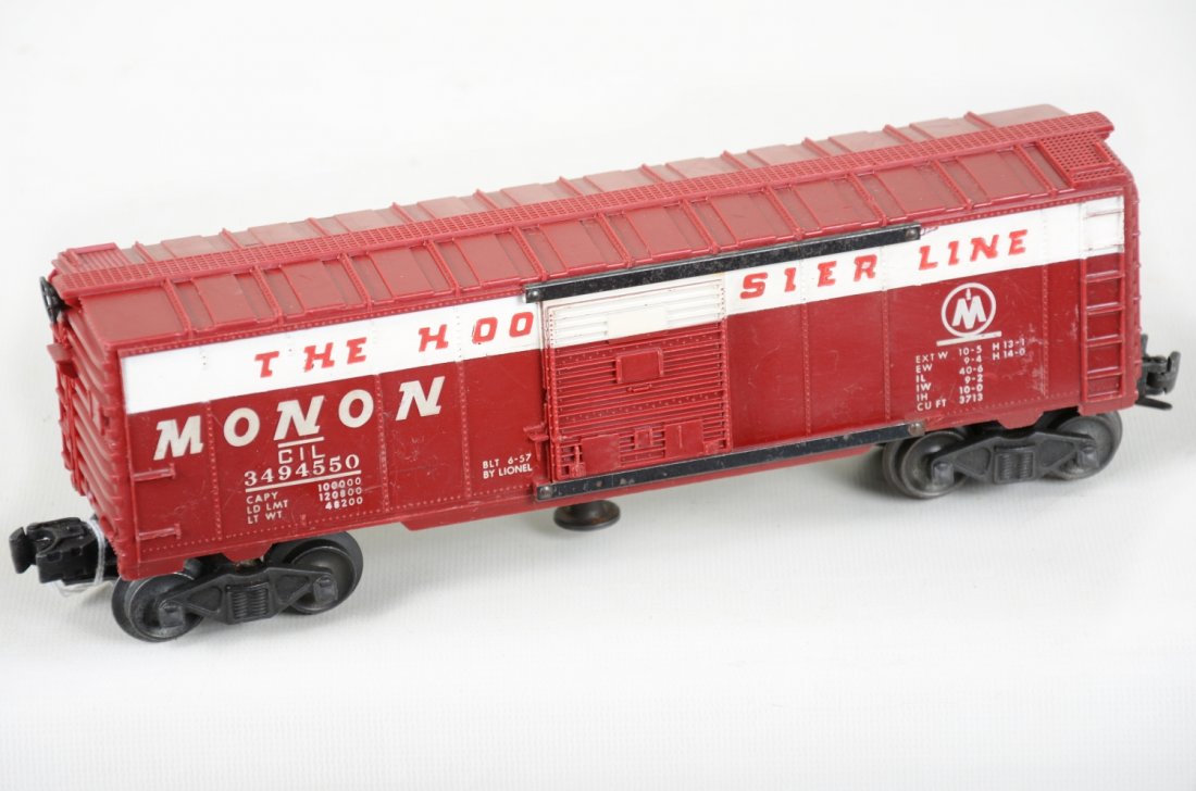 Lionel 3494-550 Monon Operating Boxcar: Scarce 1956 only production. It has nice graphics and would benefit from a cleaning. The plastic shows moderate playwear, C6+